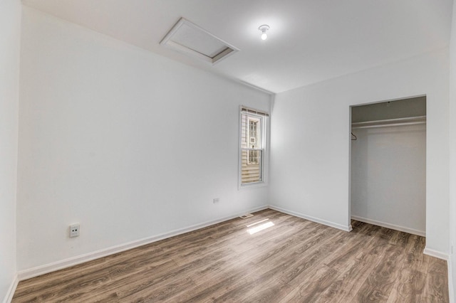 352 W 106th Pl, Chicago, IL 60628 - unfurnished bedroom with attic access, wood finished floors, and a closet