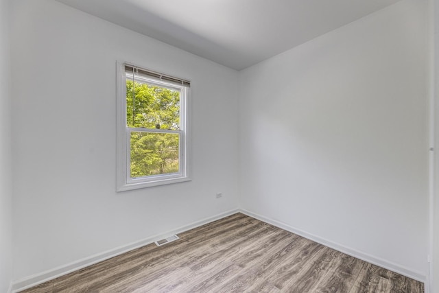 352 W 106th Pl, Chicago, IL 60628 - spare room featuring wood finished floors and baseboards