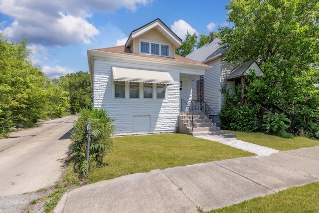 352 W 106th Pl, Chicago, IL 60628 - view of front facade with a front lawn