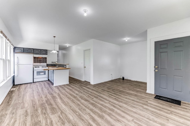 352 W 106th Pl, Chicago, IL 60628 - kitchen featuring white appliances, butcher block counters, light wood finished floors, and open floor plan