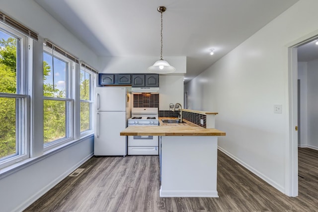 352 W 106th Pl, Chicago, IL 60628 - kitchen with butcher block counters, white appliances, dark wood finished floors, a peninsula, and tasteful backsplash