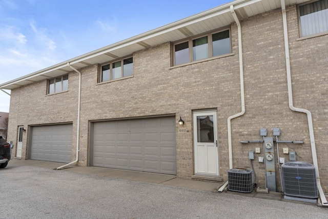 10935 California Ct Unit 185, Orland Park, IL 60467 - view of front of home featuring brick siding and a garage