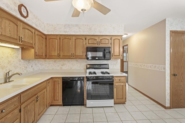 10935 California Ct Unit 185, Orland Park, IL 60467 - kitchen with black appliances, a ceiling fan, light countertops, light tile patterned flooring, and wallpapered walls