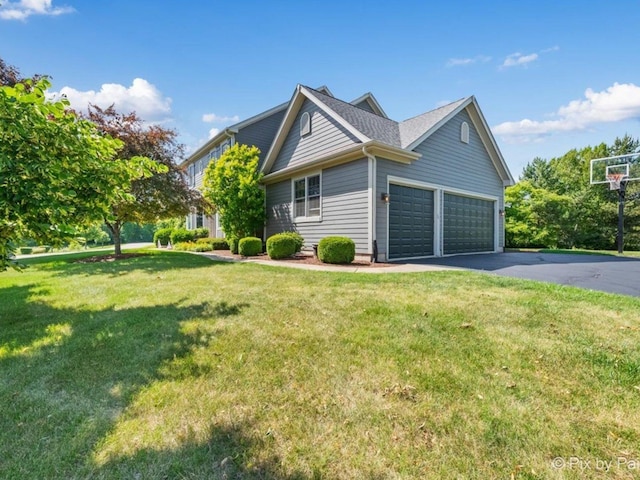 8980 Bardwell Ln, Lakewood, IL 60014 - view of property exterior featuring a yard, driveway, and a garage