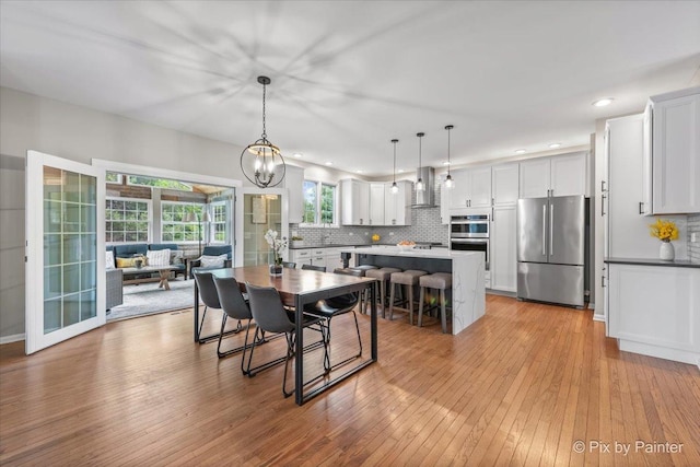 8980 Bardwell Ln, Lakewood, IL 60014 - dining area featuring light wood-style floors, a chandelier, and recessed lighting