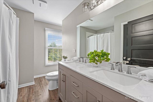 8980 Bardwell Ln, Lakewood, IL 60014 - bathroom with double vanity and wood finished floors