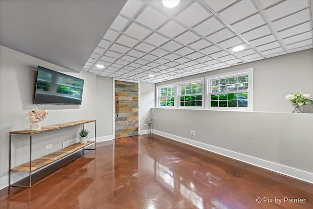 8980 Bardwell Ln, Lakewood, IL 60014 - unfurnished living room featuring concrete flooring and baseboards