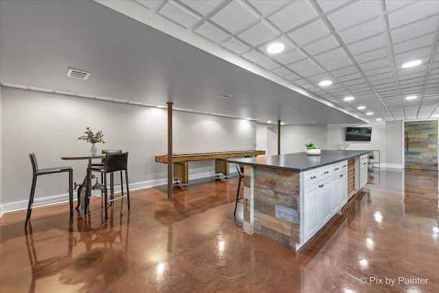 8980 Bardwell Ln, Lakewood, IL 60014 - kitchen featuring dark countertops, white cabinetry, a center island, concrete floors, and recessed lighting