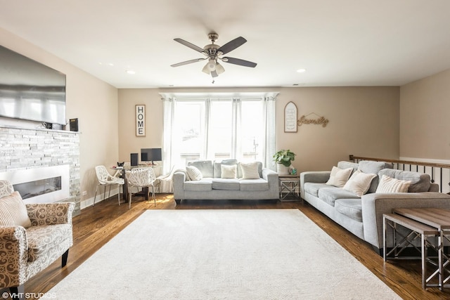 5733 S Neenah Ave, Chicago, IL 60638 - living room with ceiling fan, dark wood-style flooring, a stone fireplace, and recessed lighting