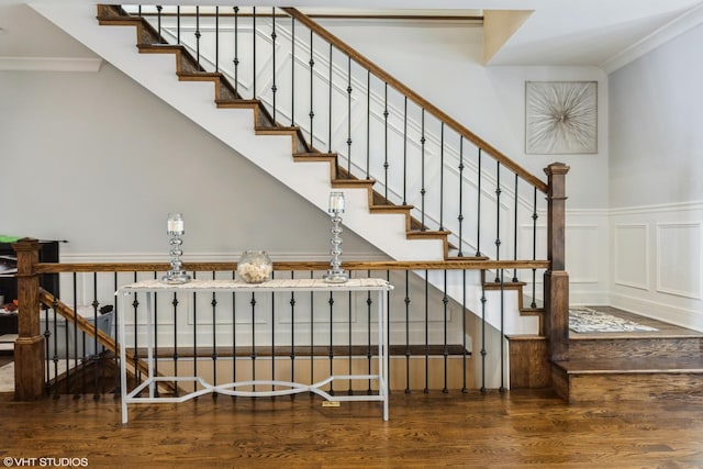 5733 S Neenah Ave, Chicago, IL 60638 - stairway with wood finished floors, crown molding, a wainscoted wall, and a decorative wall
