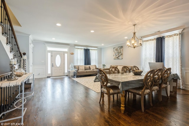 5733 S Neenah Ave, Chicago, IL 60638 - dining room featuring crown molding, a decorative wall, a chandelier, stairway, and a wainscoted wall