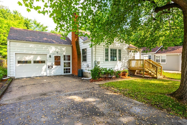 325 Douglas St, Oswego, IL 60543 - view of front of home featuring concrete driveway, an attached garage, roof with shingles, and a chimney