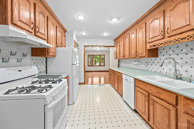 325 Douglas St, Oswego, IL 60543 - kitchen with white appliances, under cabinet range hood, light countertops, light floors, and wallpapered walls