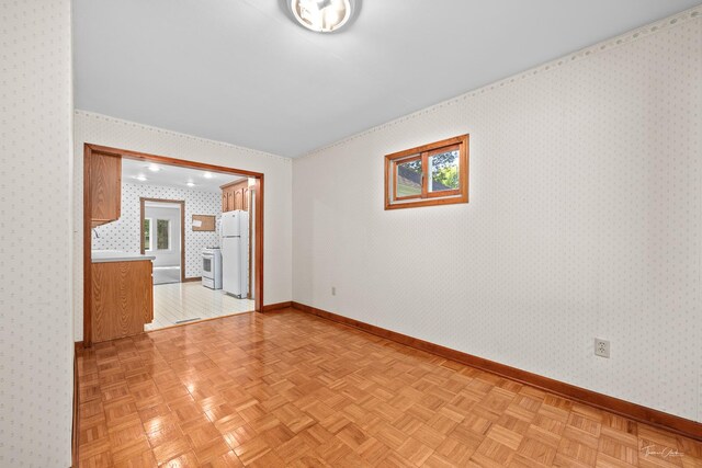 325 Douglas St, Oswego, IL 60543 - unfurnished living room featuring baseboards and wallpapered walls