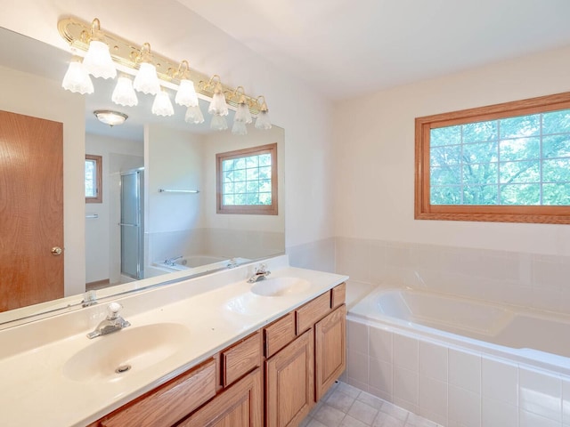 2207 Irvine Ln, Plainfield, IL 60586 - bathroom featuring a stall shower, a garden tub, plenty of natural light, and tile patterned floors