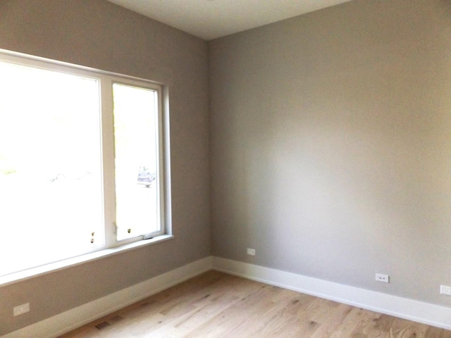 7137 S 87th Ave S, Justice, IL 60458 - unfurnished room featuring light wood-type flooring and baseboards