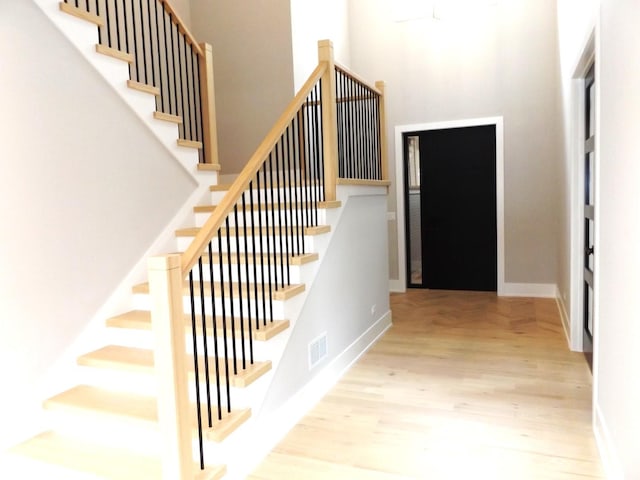 7137 S 87th Ave S, Justice, IL 60458 - stairs featuring wood finished floors and a towering ceiling
