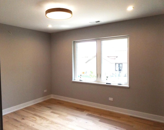 7137 S 87th Ave S, Justice, IL 60458 - unfurnished room with light wood finished floors and recessed lighting