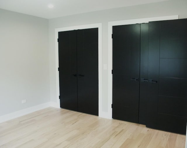 7137 S 87th Ave S, Justice, IL 60458 - unfurnished bedroom featuring wood finished floors, recessed lighting, and two closets