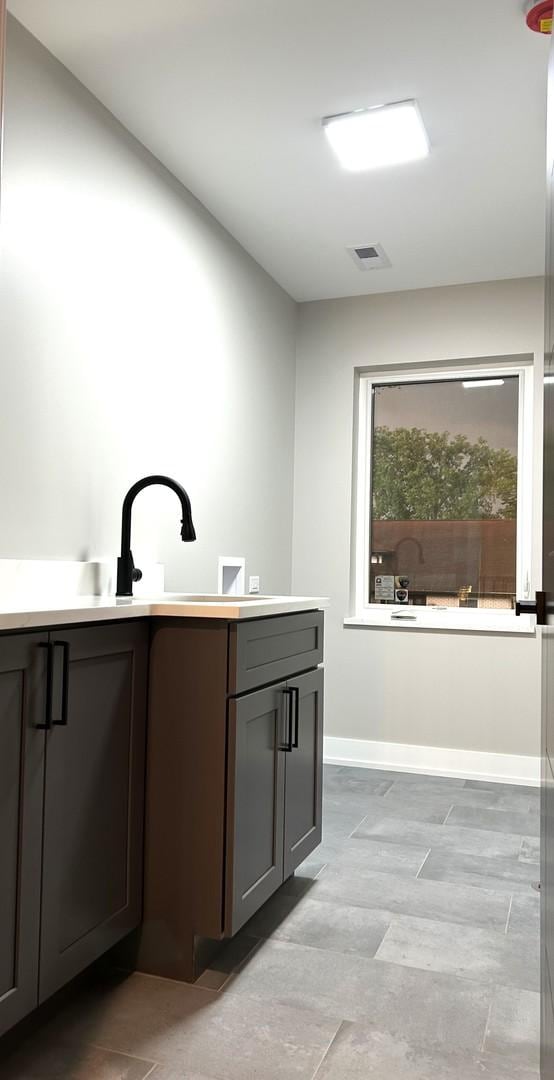 7137 S 87th Ave S, Justice, IL 60458 - bathroom featuring baseboards and vanity
