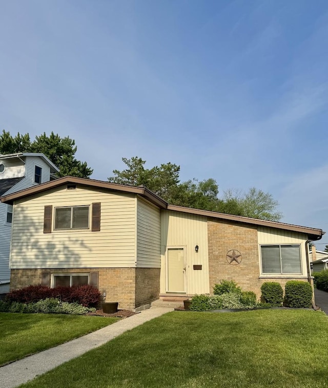 8142 N Chester Ave, Niles, IL 60714 - view of front facade with a front yard and brick siding