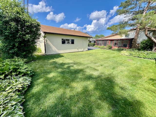 8142 N Chester Ave, Niles, IL 60714 - view of grassy yard with a sunroom