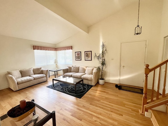 8142 N Chester Ave, Niles, IL 60714 - living room with light wood-type flooring, high vaulted ceiling, stairs, and beam ceiling