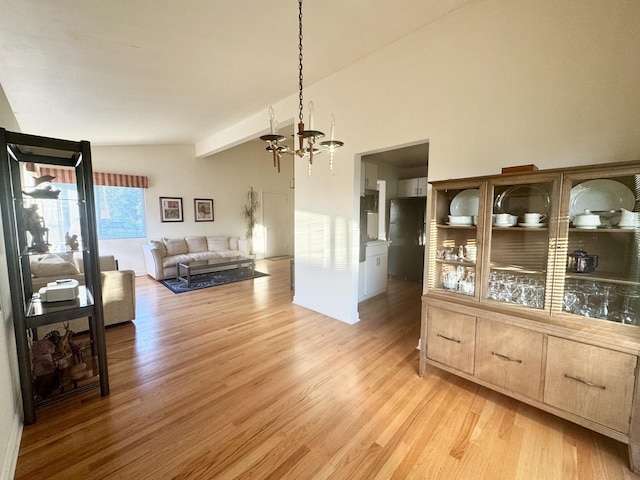 8142 N Chester Ave, Niles, IL 60714 - dining space featuring a chandelier and light wood-type flooring