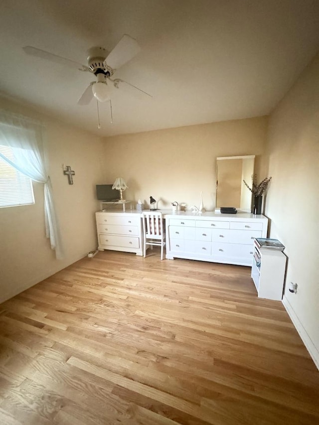 8142 N Chester Ave, Niles, IL 60714 - unfurnished bedroom featuring light wood finished floors and a ceiling fan