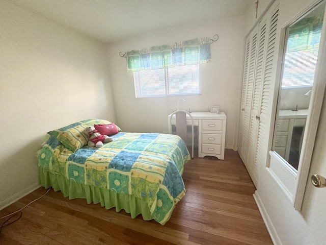 8142 N Chester Ave, Niles, IL 60714 - bedroom featuring wood finished floors and a closet