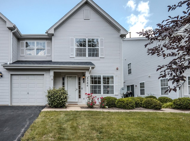 2584 Dickens Dr, Aurora, IL 60503 - traditional-style house with a front yard, a garage, and driveway