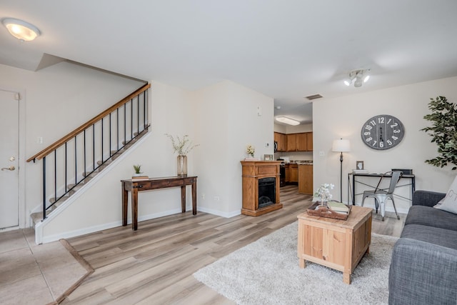2584 Dickens Dr, Aurora, IL 60503 - living room with light wood-type flooring and stairway