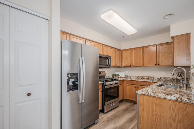 2584 Dickens Dr, Aurora, IL 60503 - kitchen with appliances with stainless steel finishes, light wood-style floors, and light stone countertops