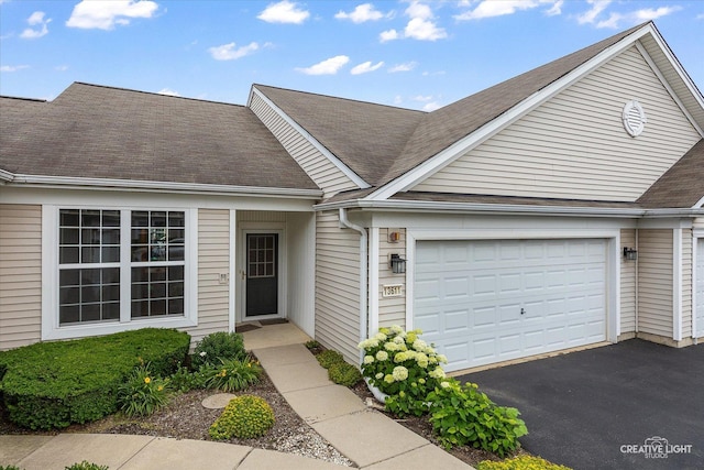 13611 Hemlock Rd, Huntley, IL 60142 - view of front of property featuring an attached garage, driveway, and a shingled roof