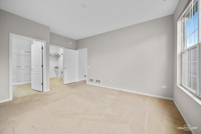 13611 Hemlock Rd, Huntley, IL 60142 - unfurnished bedroom with light carpet and a walk in closet