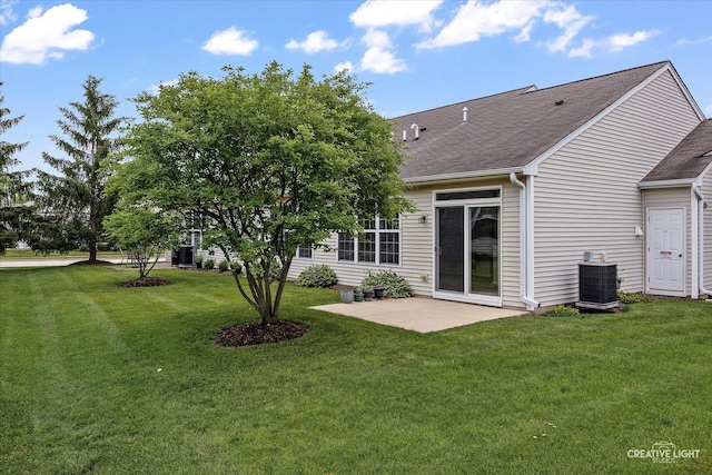 13611 Hemlock Rd, Huntley, IL 60142 - rear view of property featuring a patio, a yard, and roof with shingles