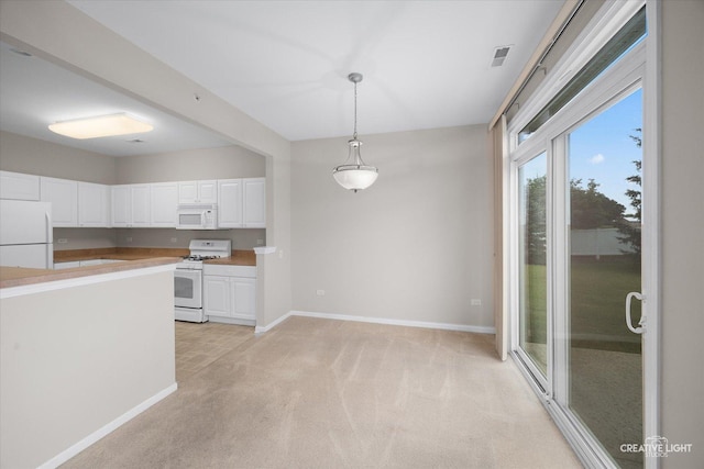 13611 Hemlock Rd, Huntley, IL 60142 - kitchen with white appliances, light colored carpet, white cabinetry, light countertops, and decorative light fixtures