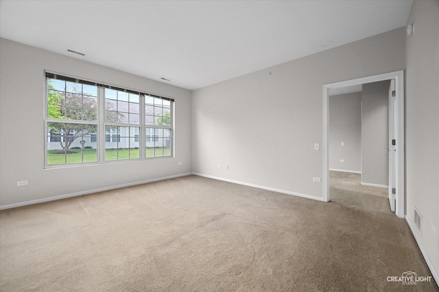 13611 Hemlock Rd, Huntley, IL 60142 - spare room featuring carpet floors and baseboards
