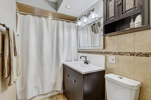 9810 N Lauren Ln, Niles, IL 60714 - bathroom featuring vanity and tile walls