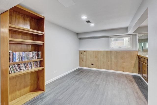 9810 N Lauren Ln, Niles, IL 60714 - bar area featuring wood finished floors, wood walls, and a wainscoted wall