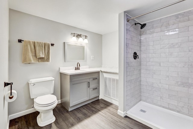 9810 N Lauren Ln, Niles, IL 60714 - bathroom featuring wood finished floors, vanity, and tiled shower