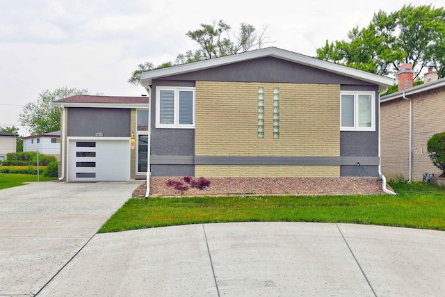 9810 N Lauren Ln, Niles, IL 60714 - view of front of home with driveway, stucco siding, and a garage