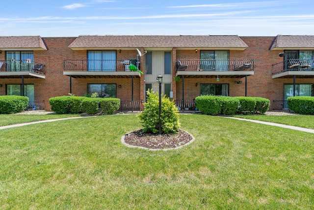 629 N Carroll Pkwy Unit 207, Glenwood, IL 60425 - view of front of house featuring brick siding and a front yard