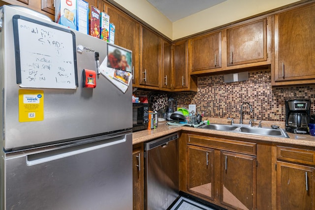 629 N Carroll Pkwy Unit 207, Glenwood, IL 60425 - kitchen featuring appliances with stainless steel finishes, backsplash, light countertops, and brown cabinets