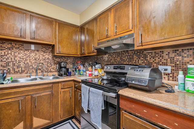 629 N Carroll Pkwy Unit 207, Glenwood, IL 60425 - kitchen with under cabinet range hood, stainless steel electric range oven, decorative backsplash, and light countertops