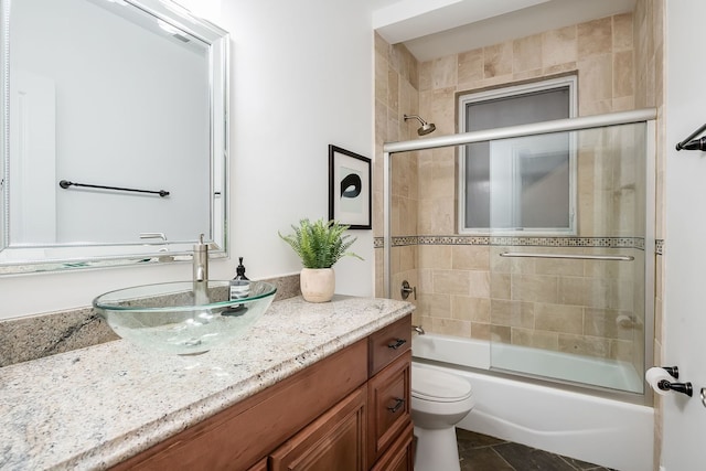 2128 N Winchester Ave, Chicago, IL 60614 - bathroom featuring vanity and bath / shower combo with glass door