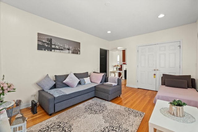 50 Forest Ave Unit 2S, Riverside, IL 60546 - living room with arched walkways, light wood-style floors, and recessed lighting