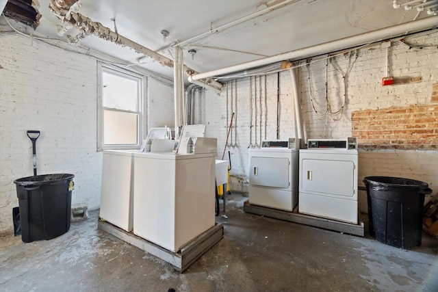 50 Forest Ave Unit 2S, Riverside, IL 60546 - basement featuring washing machine and clothes dryer and brick wall
