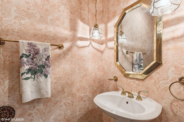 1165 Carberry Cir, Inverness, IL 60067 - half bathroom featuring a sink and wallpapered walls