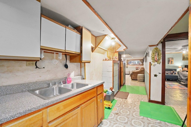 4624 W Montana St, Chicago, IL 60639 - kitchen with light countertops, light brown cabinetry, and tasteful backsplash